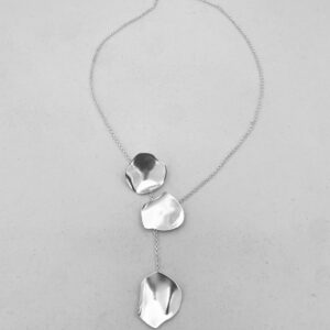 A silver necklaces with three silver rose petals.